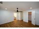 Spacious bedroom features a ceiling fan, laminate flooring, and natural light at 2157 Tiffany Ln, Lithonia, GA 30058