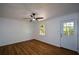 Bedroom featuring a large window, ceiling fan, and door to the exterior at 2157 Tiffany Ln, Lithonia, GA 30058