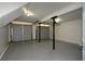 Spacious two car garage with gray doors and concrete flooring at 2157 Tiffany Ln, Lithonia, GA 30058