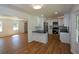 Open concept kitchen featuring white cabinets, stainless appliances, and black countertops at 2157 Tiffany Ln, Lithonia, GA 30058