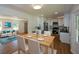 Bright kitchen and dining area with stainless steel appliances and white cabinets at 2157 Tiffany Ln, Lithonia, GA 30058