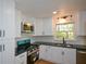 Kitchen featuring stainless appliances, subway tile backsplash, and ample lighting at 2157 Tiffany Ln, Lithonia, GA 30058