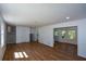Open-concept living space with wood floors, neutral walls, and natural light at 2157 Tiffany Ln, Lithonia, GA 30058