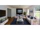 Comfortable living room with a fireplace and large windows at 2157 Tiffany Ln, Lithonia, GA 30058