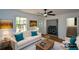 Bright living room featuring neutral tones, large window and nearby laundry room at 2157 Tiffany Ln, Lithonia, GA 30058