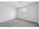 Well lit room featuring neutral walls, carpet, and natural light coming from a window at 2205 Dresden Nw Grn, Kennesaw, GA 30144