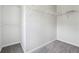 Walk-in closet includes carpeted floor and wire shelving for storage at 2205 Dresden Nw Grn, Kennesaw, GA 30144