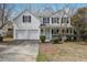 Charming two-story home with a two-car garage and classic white siding at 2205 Dresden Nw Grn, Kennesaw, GA 30144