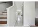 Bright hallway with wood-look flooring and a staircase on the left at 2205 Dresden Nw Grn, Kennesaw, GA 30144