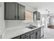 Kitchen featuring gray cabinets, light countertops and a view of an eat-in area at 2205 Dresden Nw Grn, Kennesaw, GA 30144