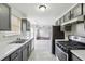 Kitchen area with gray cabinetry and appliances at 2205 Dresden Nw Grn, Kennesaw, GA 30144