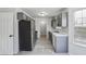 Galley kitchen with gray cabinets and modern black appliances at 2205 Dresden Nw Grn, Kennesaw, GA 30144