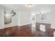 Open living room area with hardwood floors and staircase access at 2205 Dresden Nw Grn, Kennesaw, GA 30144