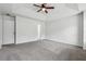 Spacious main bedroom featuring neutral walls, carpet, and natural light at 2205 Dresden Nw Grn, Kennesaw, GA 30144