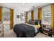 Well-lit bedroom with large windows, offering a view and enhancing the cozy feel at 465 Madison Lakeview Dr, Acworth, GA 30102