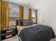Bedroom with large windows that fill the space with natural light and stylish black accents at 465 Madison Lakeview Dr, Acworth, GA 30102