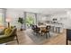 Open floor plan showcasing the dining area connected to a modern white kitchen with a center island at 465 Madison Lakeview Dr, Acworth, GA 30102