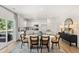 Bright dining area with a modern table set, situated next to a stylish, well-lit kitchen space at 465 Madison Lakeview Dr, Acworth, GA 30102