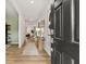 Inviting entryway boasts wood floors, neutral walls, and stylish decor, creating a warm and welcoming ambiance into the home at 465 Madison Lakeview Dr, Acworth, GA 30102