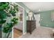 Hallway with view of the primary bedroom, ensuite bath, and a storage cabinet at 465 Madison Lakeview Dr, Acworth, GA 30102