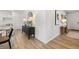 Entrance featuring wood floors, modern decor, and an open view into the living and dining areas at 465 Madison Lakeview Dr, Acworth, GA 30102