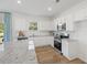 Well-lit kitchen features white cabinets, granite countertops, stainless steel appliances, and island with seating, creating a modern space at 465 Madison Lakeview Dr, Acworth, GA 30102