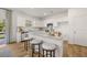 Bright kitchen featuring white cabinets, granite countertops, stainless steel appliances, and a cozy island with bar stool seating at 465 Madison Lakeview Dr, Acworth, GA 30102