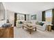 Comfortable living room with a plush sectional couch and decorative pillows at 465 Madison Lakeview Dr, Acworth, GA 30102