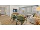 Spacious living area with hardwood floors, comfortable seating, and large windows for ample natural light at 465 Madison Lakeview Dr, Acworth, GA 30102