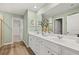 Elegant main bathroom features dual sinks, granite countertops, and modern lighting at 465 Madison Lakeview Dr, Acworth, GA 30102