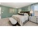 Main bedroom featuring carpet flooring, a large bed and soothing natural light at 465 Madison Lakeview Dr, Acworth, GA 30102