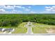 Aerial shot of a community entrance featuring meticulously manicured lawns, sidewalks and mature trees at 8599 Secretariat Dr, Lithonia, GA 30058