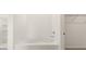Bathroom showcasing a soaking tub next to a shower stall and closet at 8599 Secretariat Dr, Lithonia, GA 30058