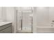 Bathroom with marble countertops, a shower stall, and a soaking tub at 8599 Secretariat Dr, Lithonia, GA 30058