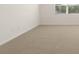 Bright and airy bedroom featuring plush carpeting and a window for natural light at 8599 Secretariat Dr, Lithonia, GA 30058