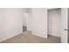 Neutral bedroom with open closet and view to hallway at 8599 Secretariat Dr, Lithonia, GA 30058