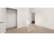 This bedroom offers neutral carpet and the closet with ample storage at 8599 Secretariat Dr, Lithonia, GA 30058