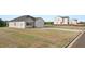 A charming single-Gathering home with a two-car garage, a gray roof, and light siding at 8599 Secretariat Dr, Lithonia, GA 30058