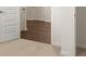 Hallway view highlights wood-look flooring and modern design at 8599 Secretariat Dr, Lithonia, GA 30058