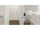 Kitchen features a pantry, stainless refrigerator, and gray cabinets at 8599 Secretariat Dr, Lithonia, GA 30058