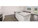 An open kitchen with stainless steel appliances, an island, and a view to the living room at 8599 Secretariat Dr, Lithonia, GA 30058