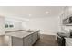 Kitchen features gray cabinets and granite countertops with stainless appliances at 8599 Secretariat Dr, Lithonia, GA 30058