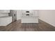 Kitchen featuring an island with granite countertops, stainless steel appliances, and white cabinets with wood-look flooring at 8599 Secretariat Dr, Lithonia, GA 30058
