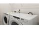 A modern laundry room features new washer and dryer with clean design at 8599 Secretariat Dr, Lithonia, GA 30058
