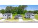 View of Champions Run street with various new construction homes and green lawns at 8599 Secretariat Dr, Lithonia, GA 30058