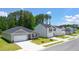 Street view of new construction homes featuring craftsman-style architecture, garages, and landscaped yards at 8599 Secretariat Dr, Lithonia, GA 30058