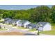 View of Champions Run street with various new construction homes and green lawns at 8599 Secretariat Dr, Lithonia, GA 30058