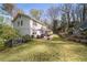 Spacious backyard with lush green lawn, patio, dining area, and landscaped garden at 440 River Valley Rd, Atlanta, GA 30328