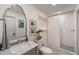 Cozy bathroom featuring a marble countertop, shower, and toilet with simple decor at 440 River Valley Rd, Atlanta, GA 30328