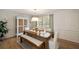 Elegant dining room with natural light, hardwood floors and stylish furnishings at 440 River Valley Rd, Atlanta, GA 30328